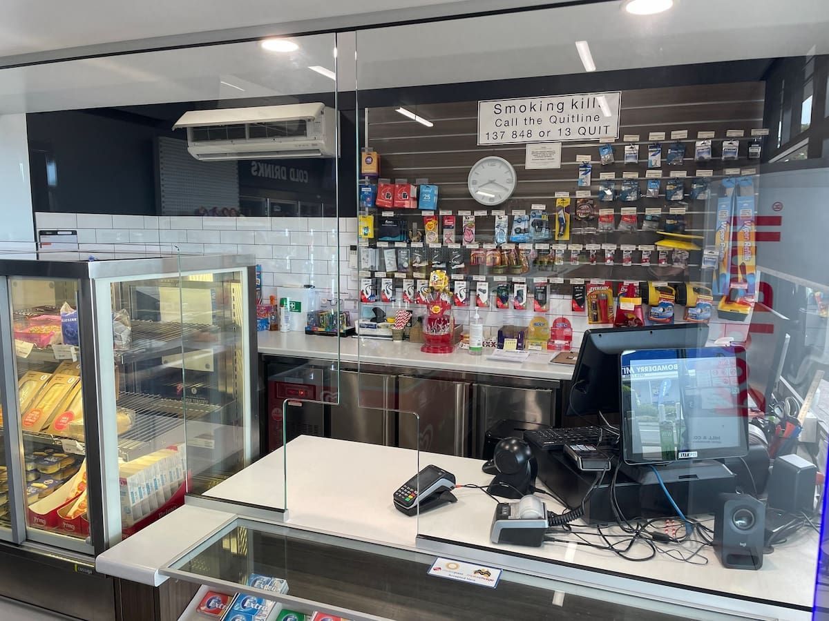 The Inside Of A Convenience Store With A Counter And A Display Case — South Coast Glass In South Nowra, NSW