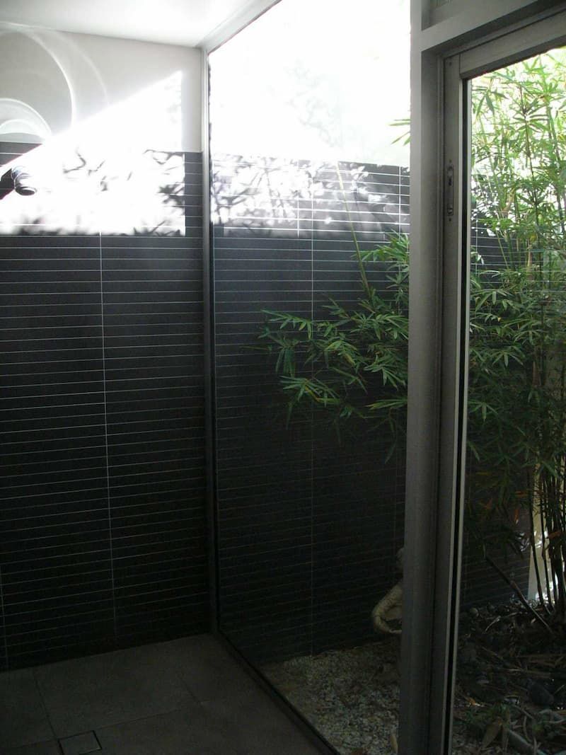 A Room With A Sliding Glass Door And A Black Wall — South Coast Glass In South Nowra, NSW