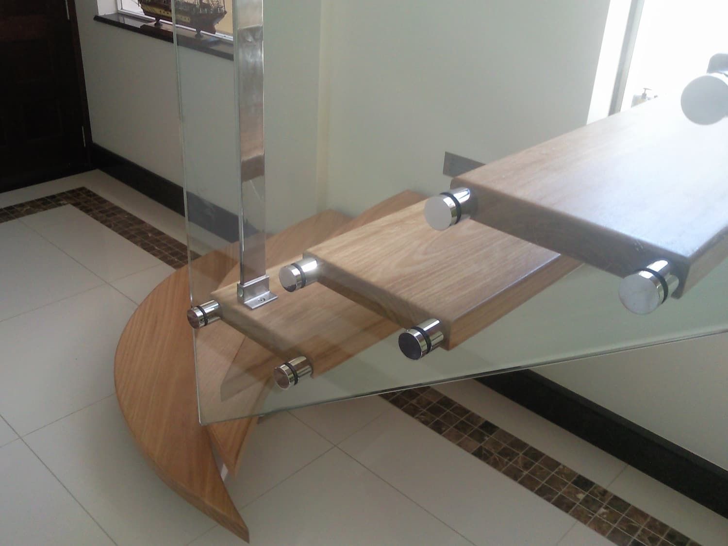 A Staircase With A Glass Railing And Wooden Steps — South Coast Glass In South Nowra, NSW