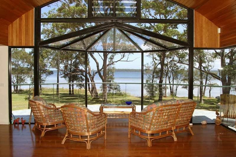 A Living Room With A View Of A Lake And Trees — South Coast Glass In South Nowra, NSW