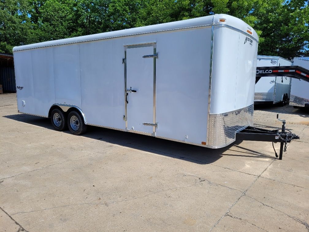 White enclosed trailer on concrete in daylight. | Gainesville Garage & Trailer Sales