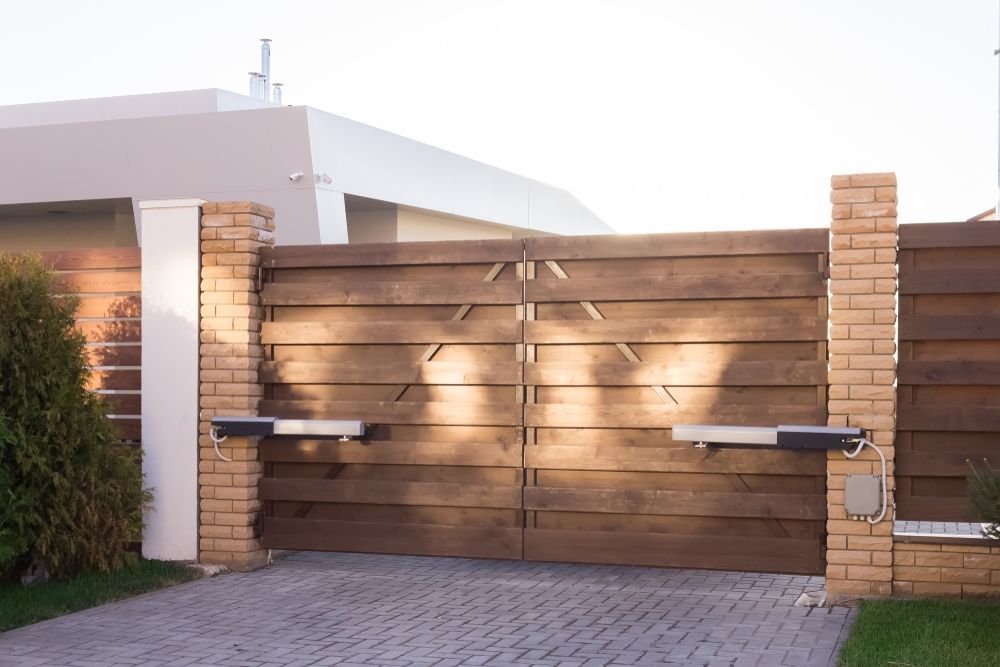A Wooden Gate is Open to a Driveway in Front of a House — All Clean Pressure Cleaning in Merewether, NSW