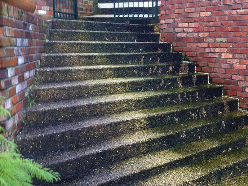 A Set of Stairs Leading Up to a Brick Wall — All Clean Pressure Cleaning in Valentine, NSW