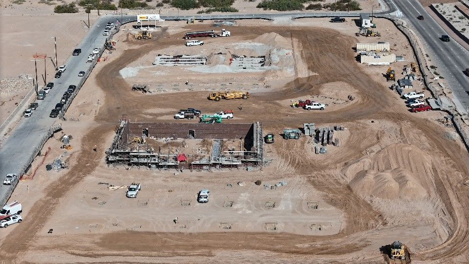 An aerial view of a construction site in the desert.