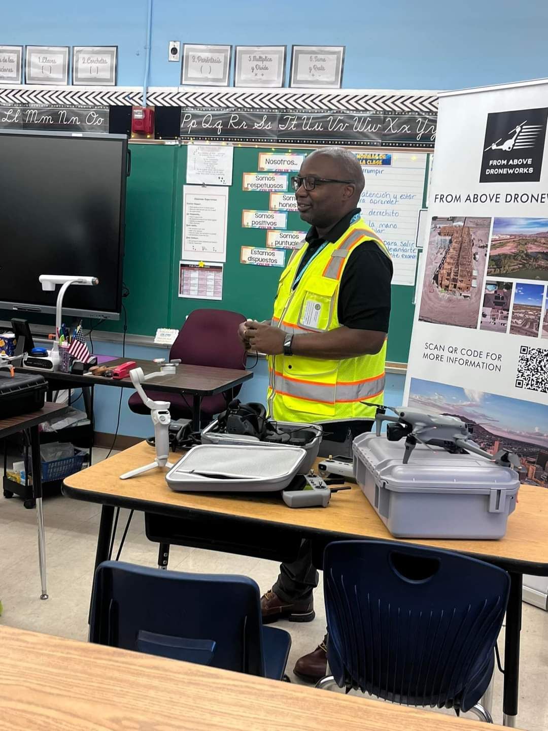 A drone training session in progress, with a trainee pilot operating a drone under supervision.
