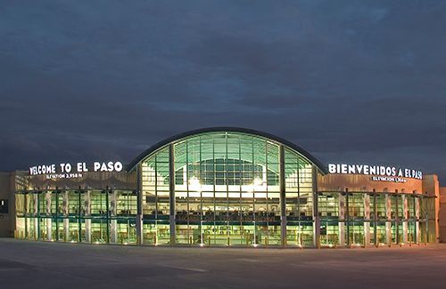 Nighttime view of El Paso International Airport Main Terminal illuminated by exterior lights.