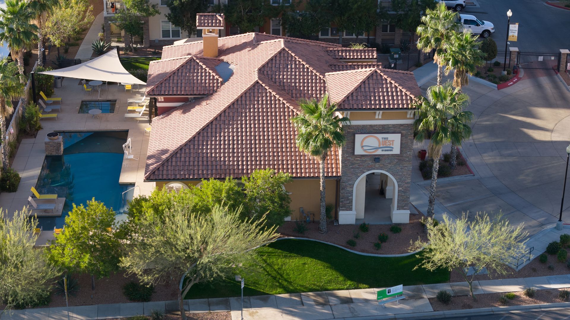 Aerial shot of The Quest at Edgemere in El Paso, TX, showcasing the apartment complex layout and surrounding area.