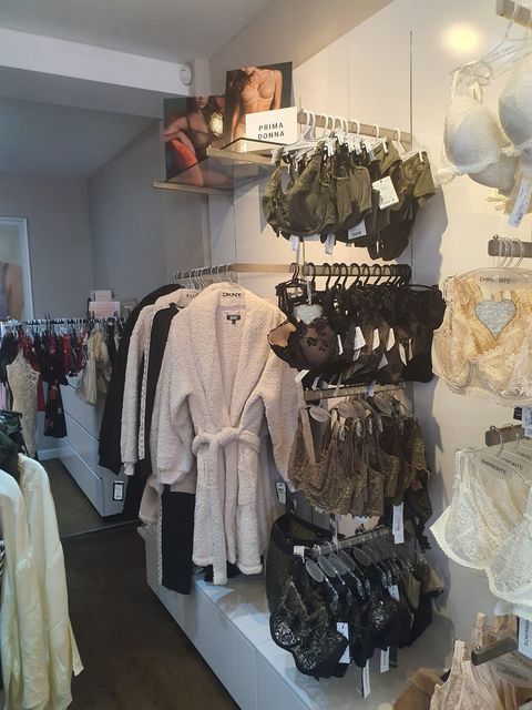 A store filled with lots of clothes including a robe