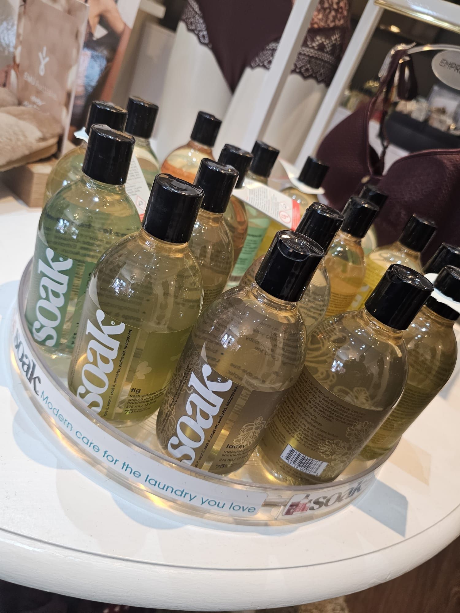 Several bottles of soak are on a tray on a table