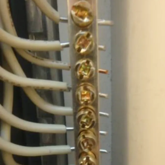 Faulkner Electric Employee holding Electrical Panel