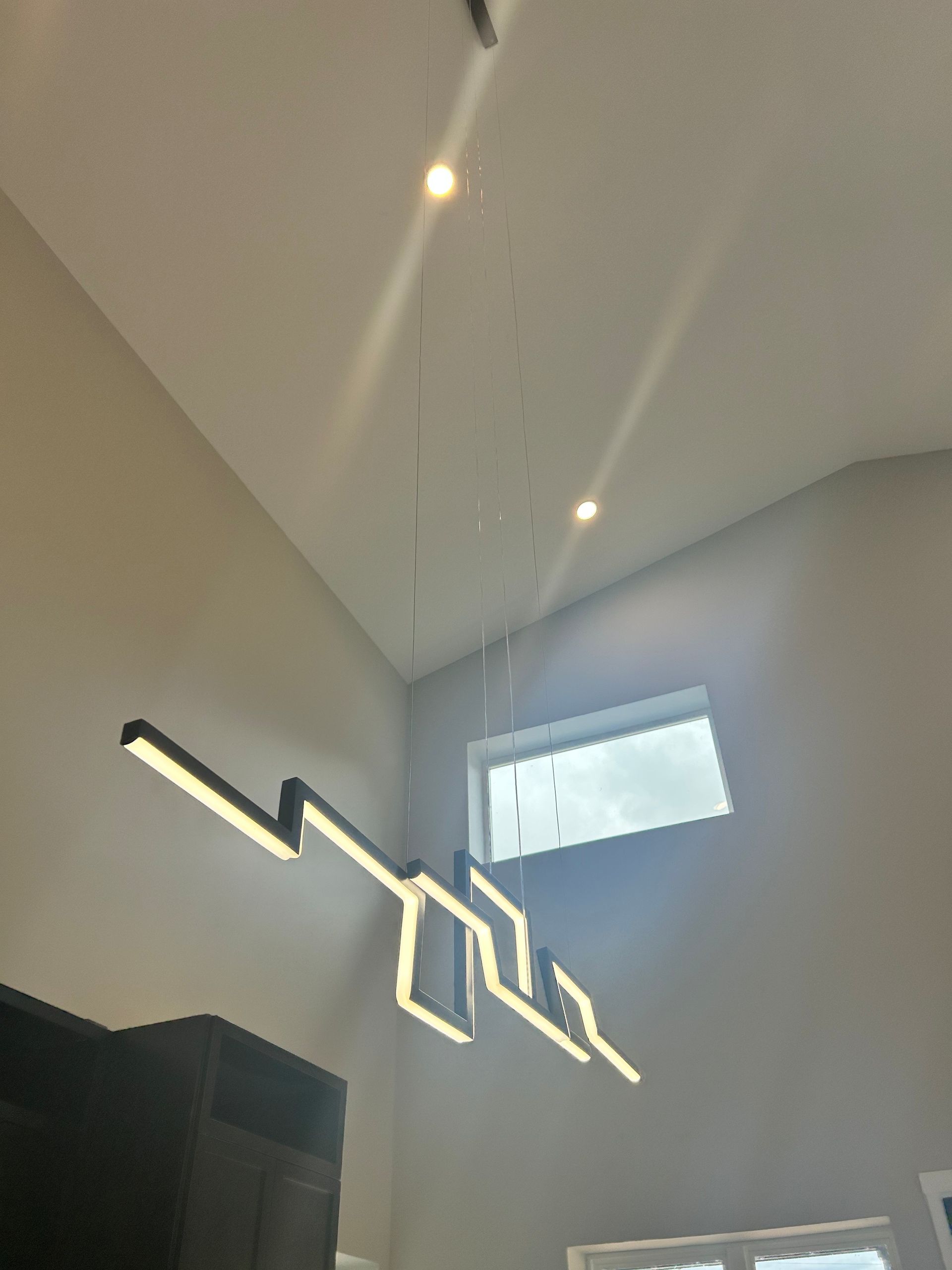 High-ceiling with newly installed recess lights by Faulkner Electric