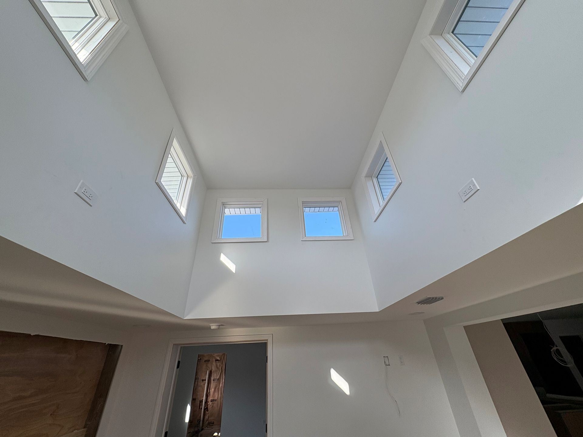 High ceiling wall plug installation done in new modern home in Zephyrhills, FL