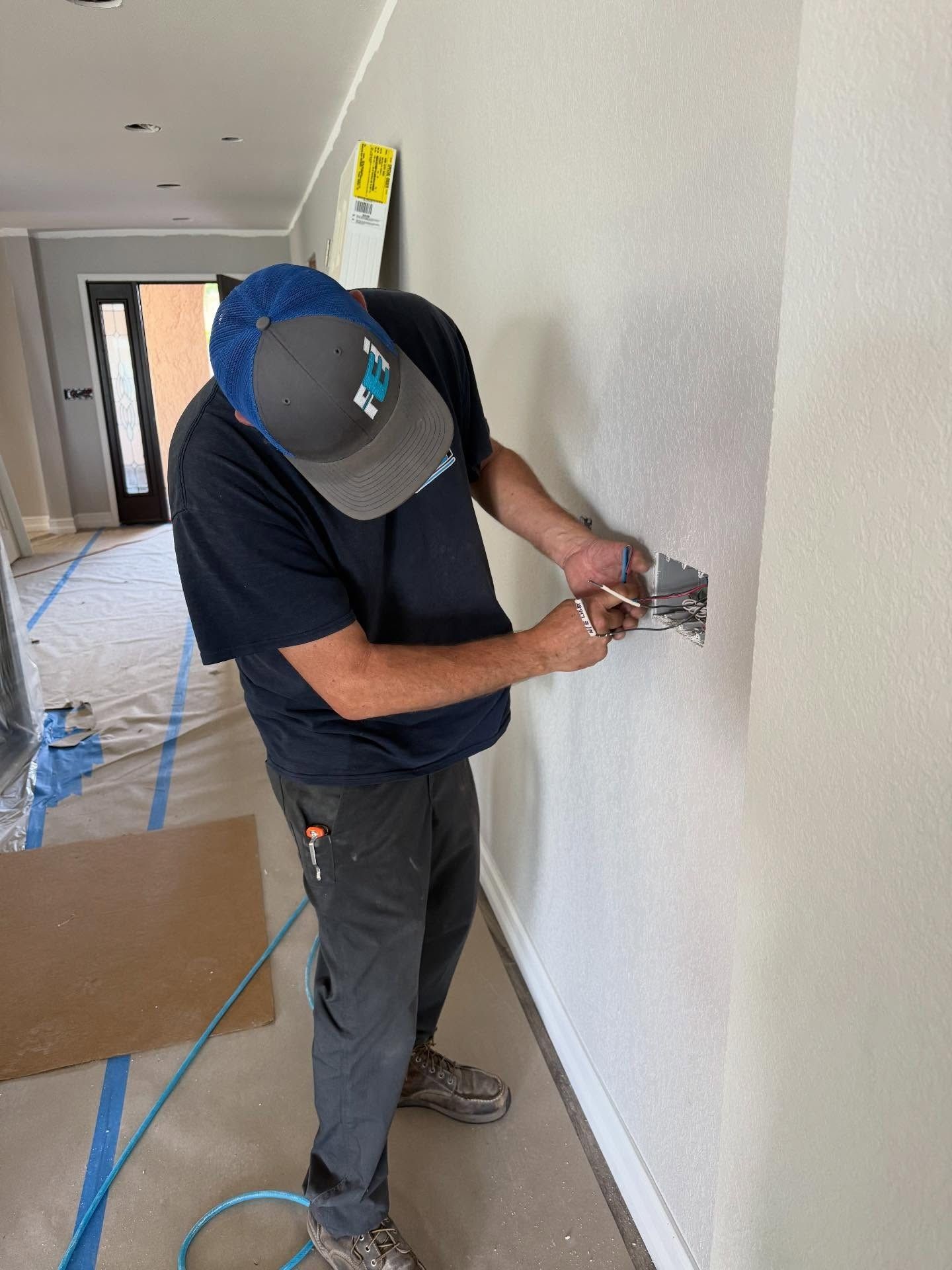 Faulkner Electrician hard at work for a residential job in Spring Hill, FL