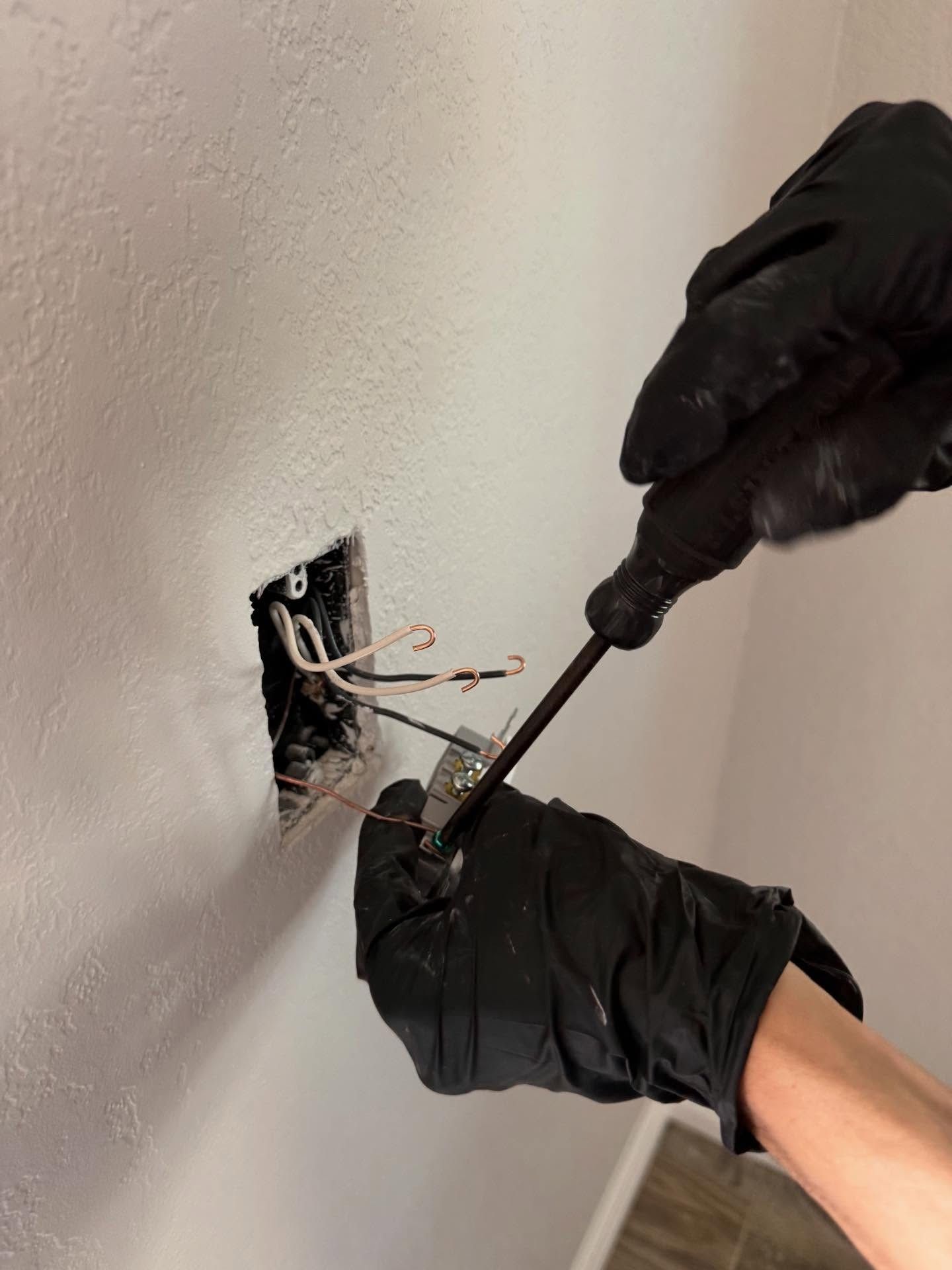 Faulkner Electrician hard at work testing electrical