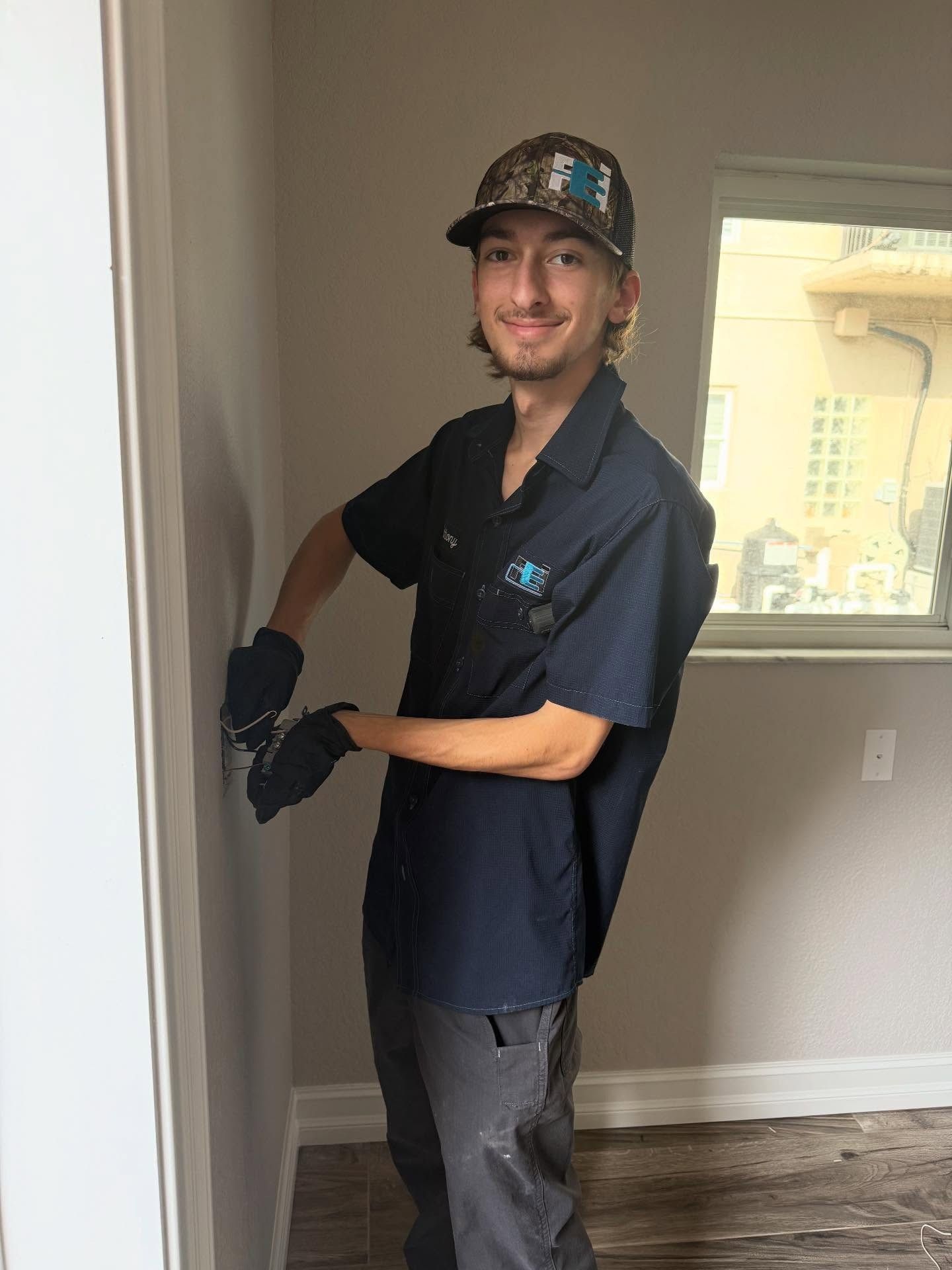 Faulkner Electrician smiling while on a job in Hudson, FL