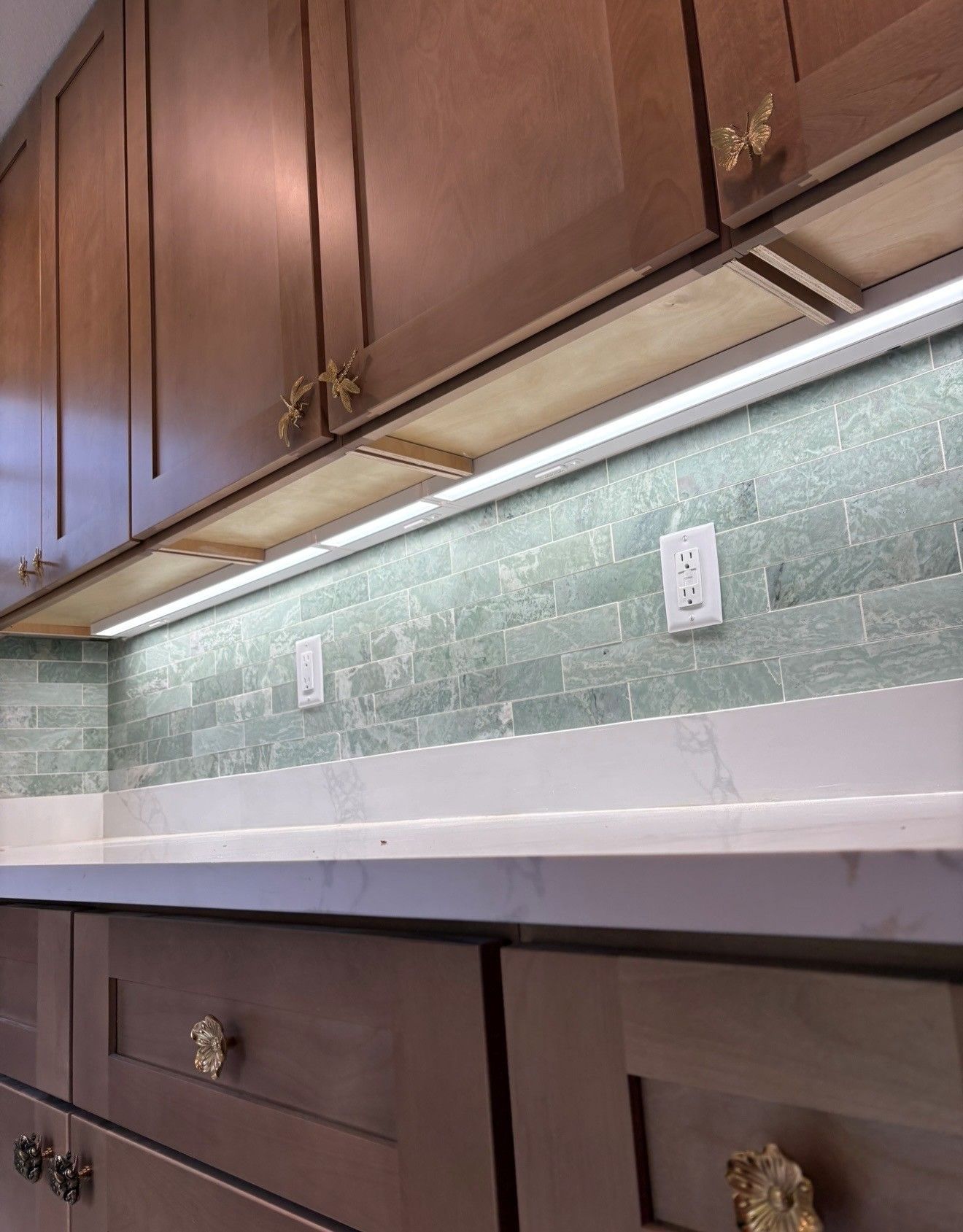 Custom lighting installed underneath the kitchen cabinets of a Brooksville, FL home