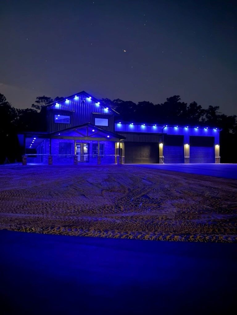 Custom outdoor lighting along the underside of a roof