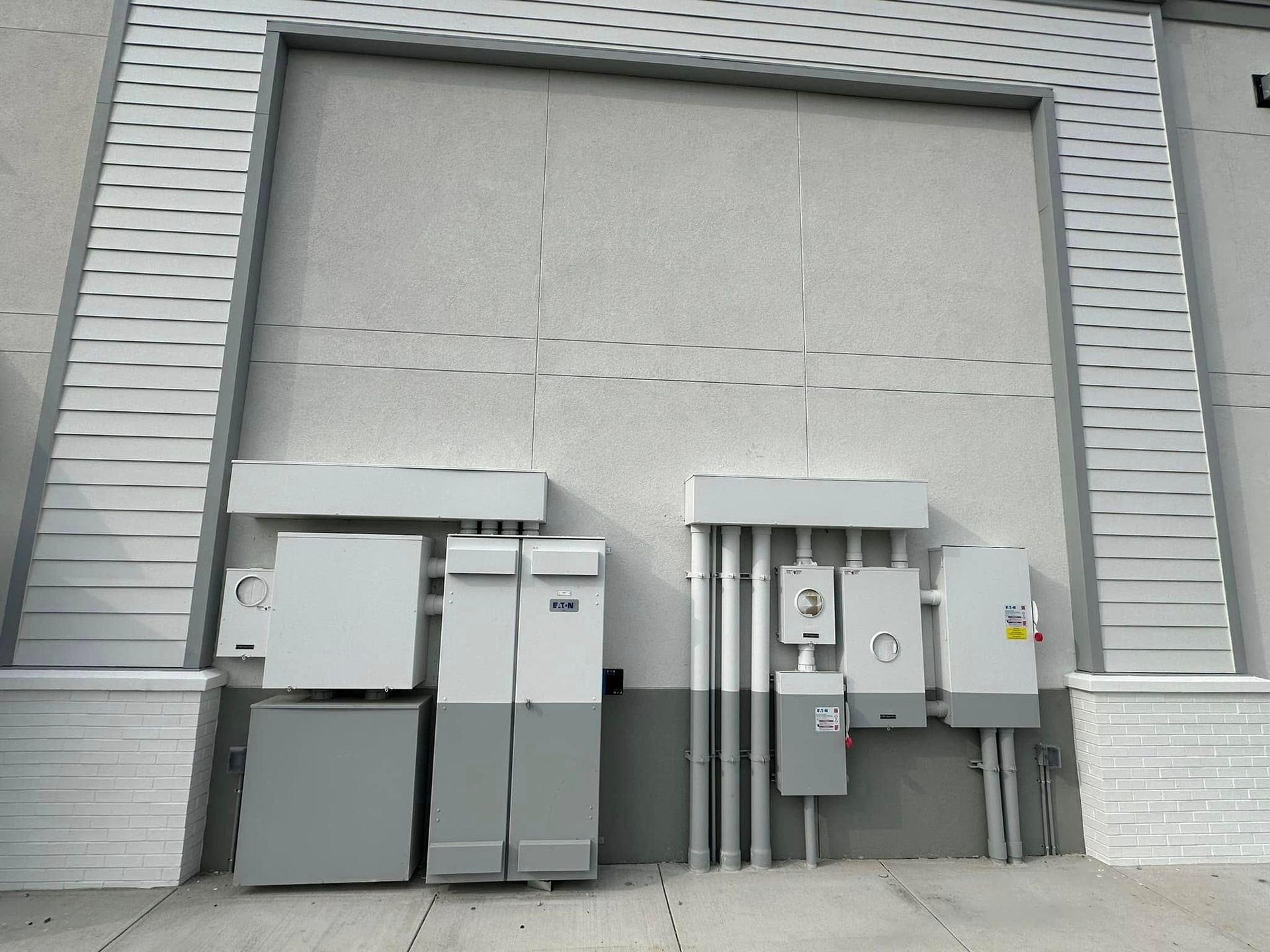 Freshly installed electric units on the exterior of a new commercial property
