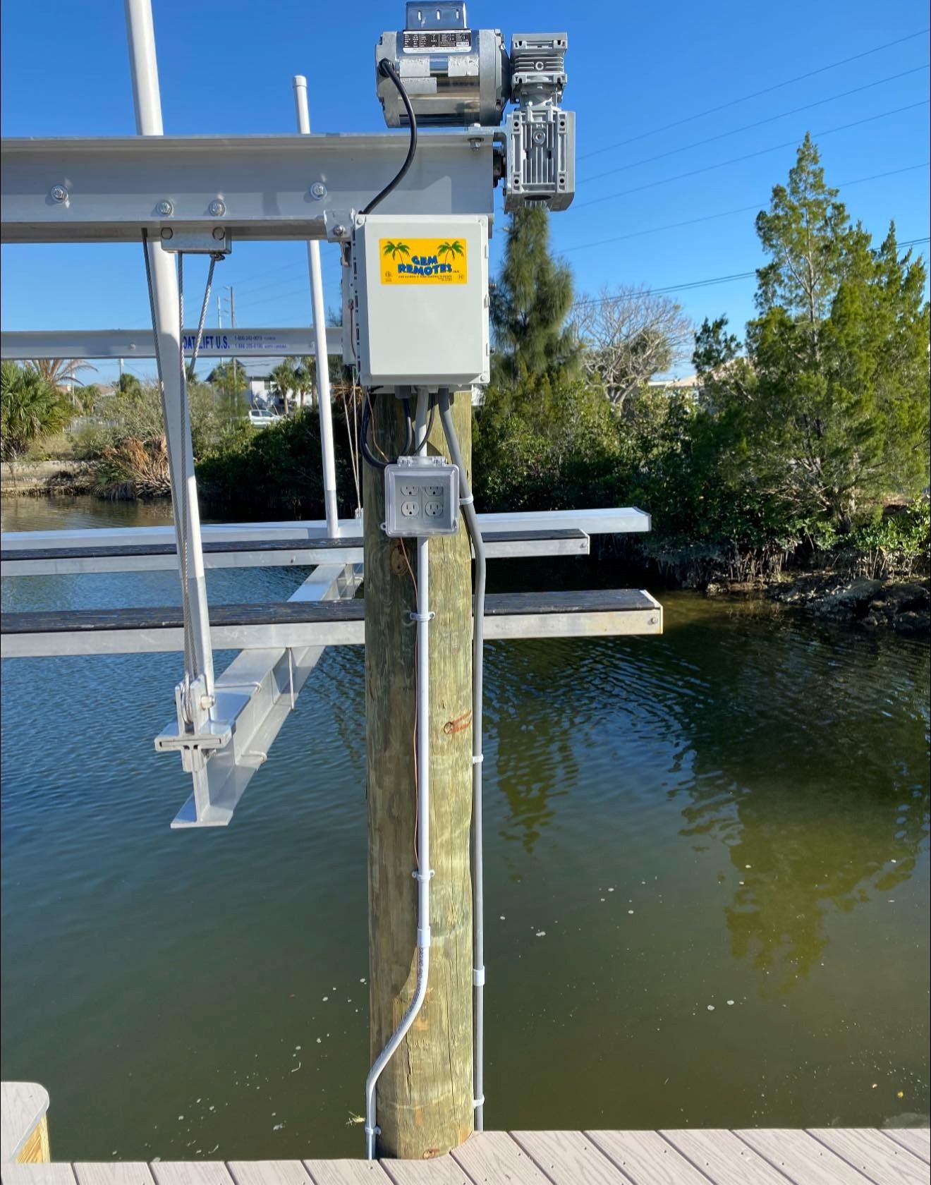 Boat lift installation for a Tarpon Springs, florida coastal home.