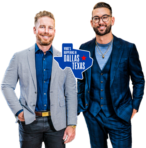 Two men standing beside a blue “Dallas Texas” sign, smiling in coordinated suits