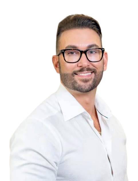 Portrait of a smiling man in glasses wearing a white shirt against a white background