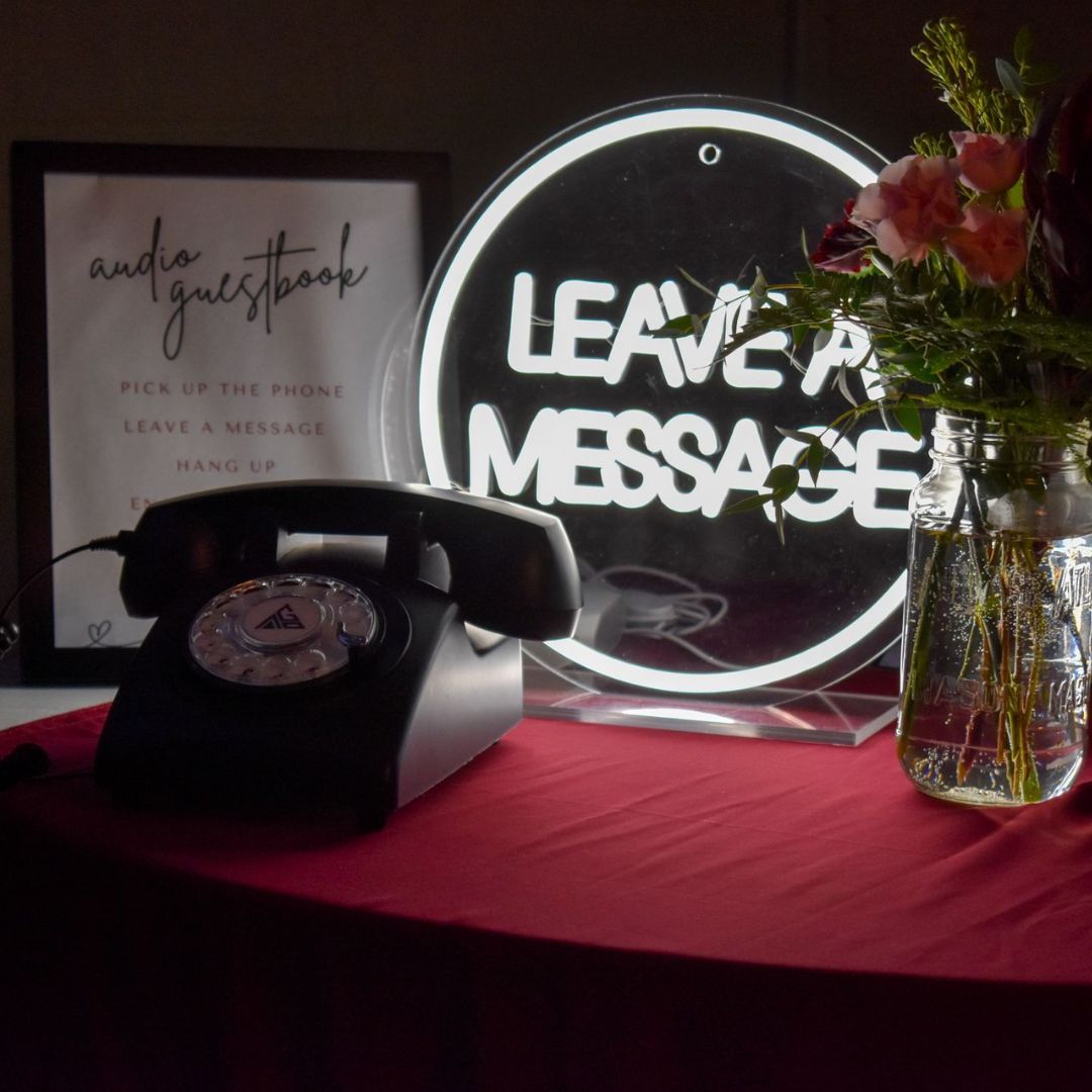 A sign that says leave a message next to a phone