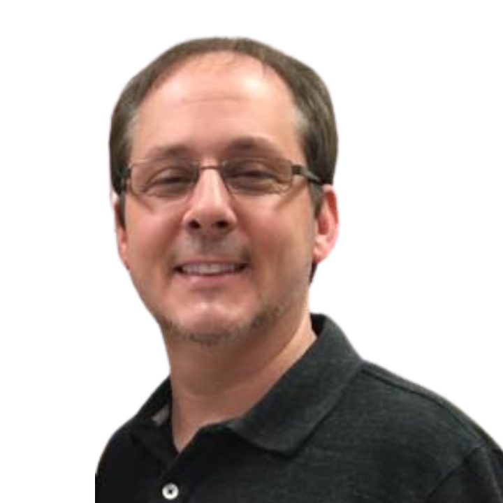 A man wearing glasses and a black shirt smiles for the camera