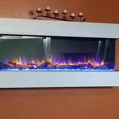 Wall-mounted electric fireplace with blue and orange flames against a brown wall