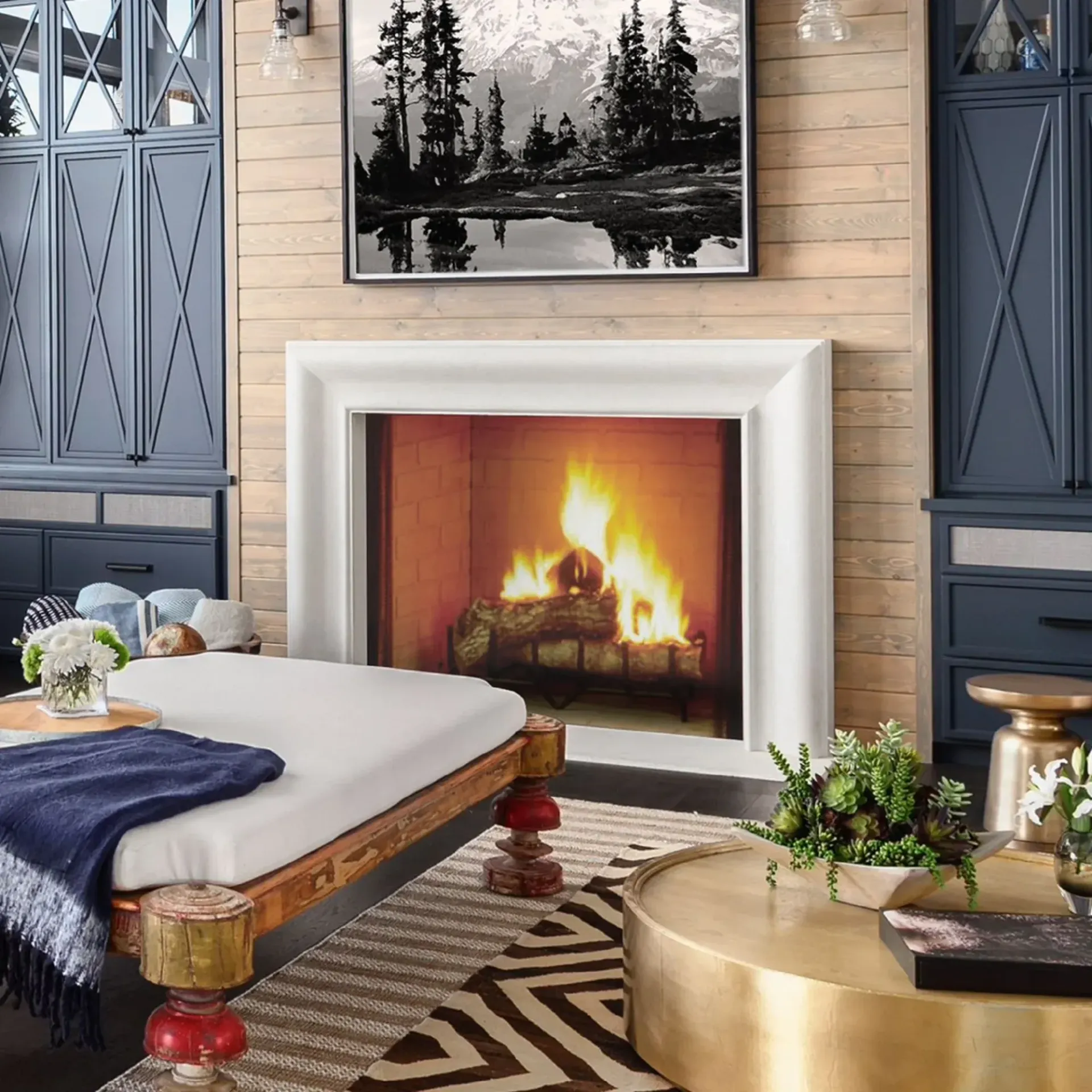 Warm rustic room with several lit wood stoves, stone hearths, and wood-paneled walls.