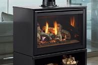 Modern black electric fireplace with visible flames in a contemporary room