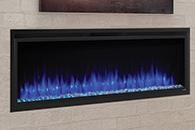 Wall-mounted linear fireplace with blue flames against a beige tiled wall
