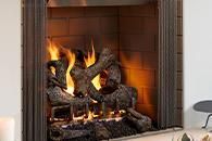 Modern fireplace with burning logs and flames in a tiled hearth