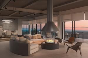 Modern living room with a central fireplace, beige sectional sofa, and floor-to-ceiling windows at sunset