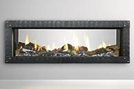 Modern wall-mounted linear fireplace with glass front and visible flames