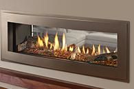 Modern wall-mounted fireplace with glass front and active flames