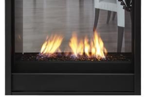 Modern black fireplace with bright flames and glass front