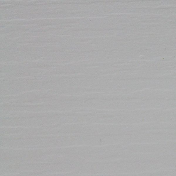 Light gray painted surface with visible brushstrokes.