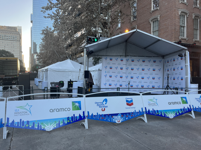 Outdoor stage set up for an event; sponsored by Aramco, Chevron. Houston, Texas.