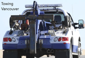 Towing Vancouver Roadside Assistance blue and white tow truck.