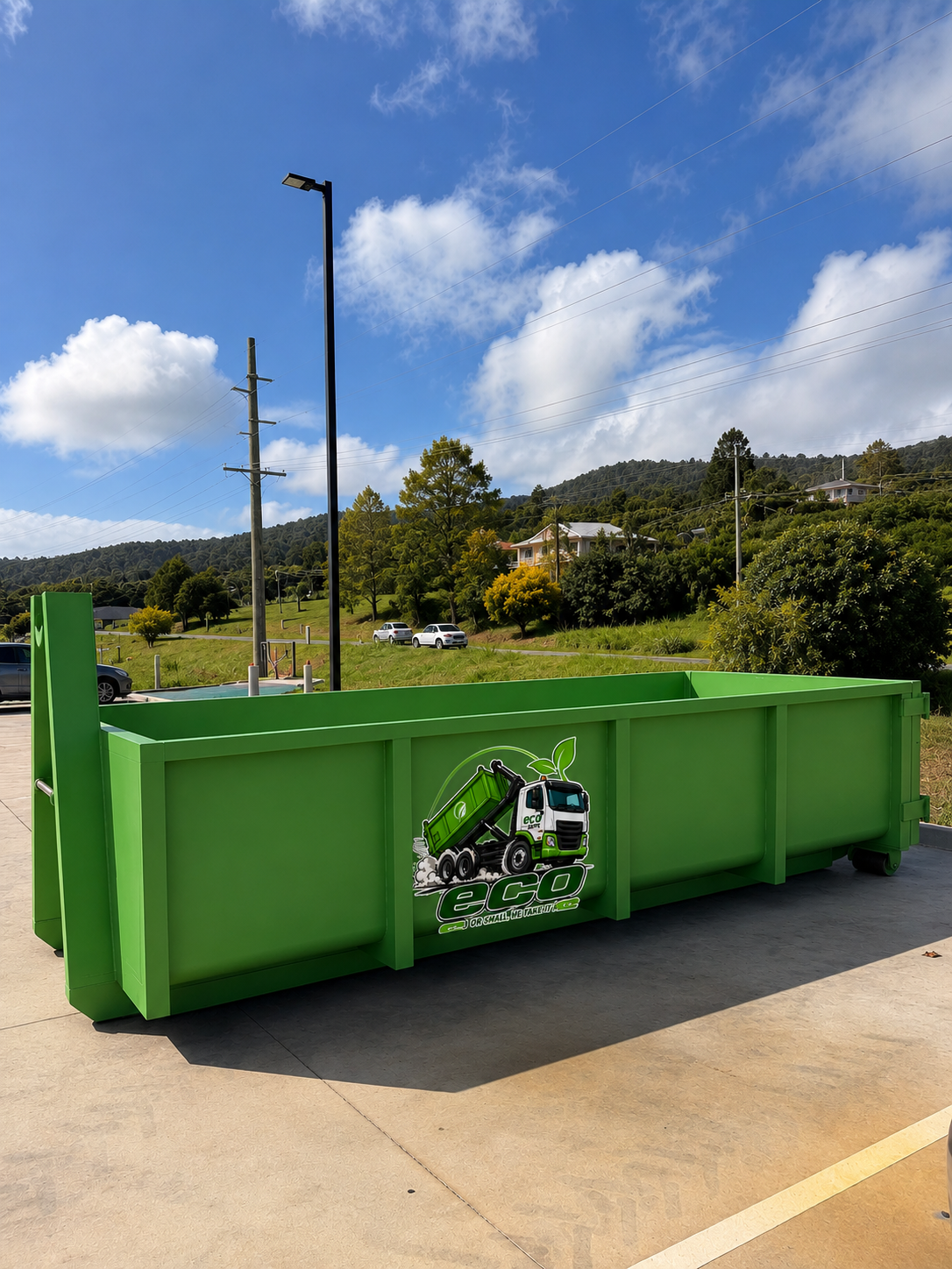 Green Recycling Dumpster Outdoors on a Sunny Road — Eco Skips In Midge Point, QLD
