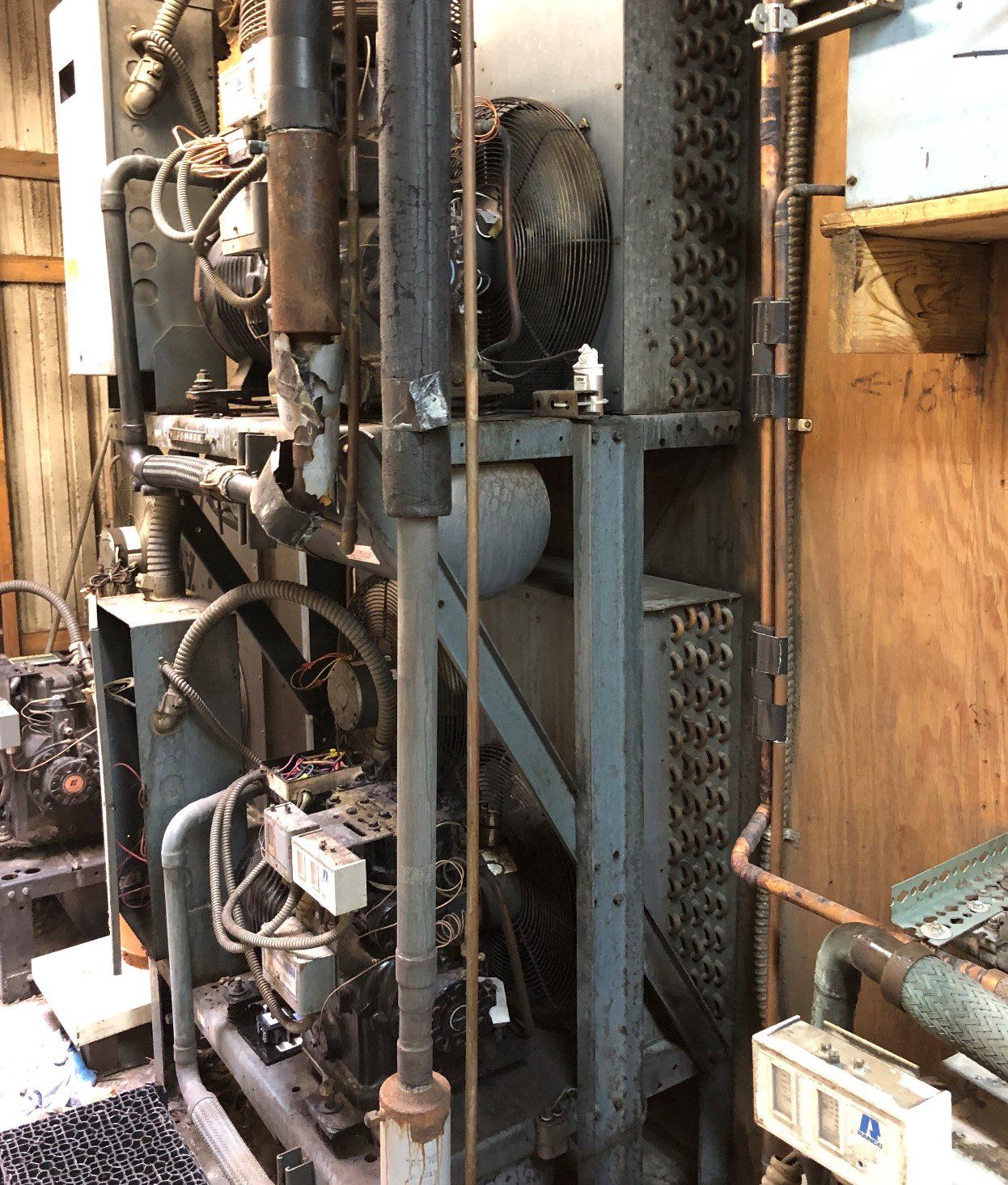 Technician Repairing Gas Furnace — Lexington, KY — High Vac Services! Technician Repairing Gas Furnace — Lexington, KY — High Vac Services!