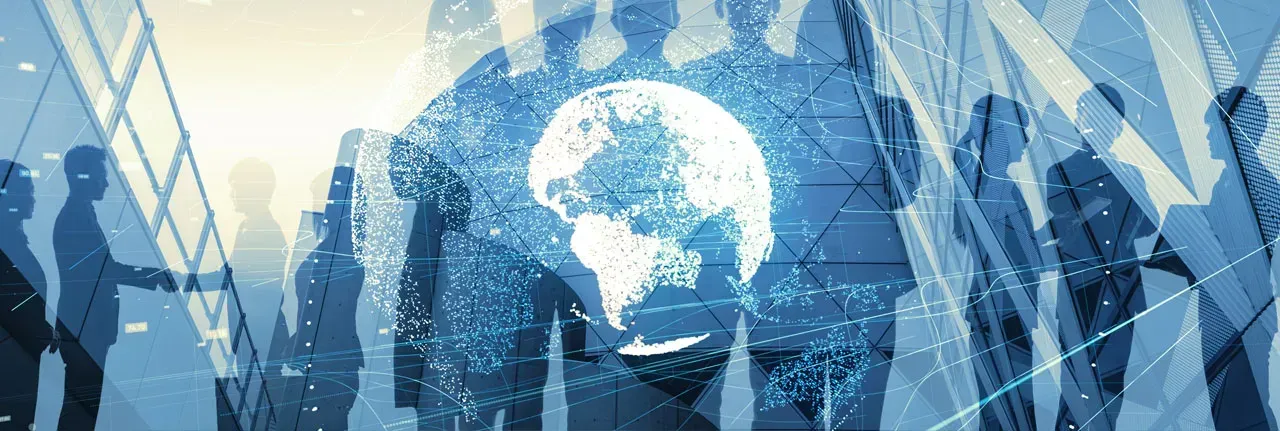 A group of people are standing in front of a globe.