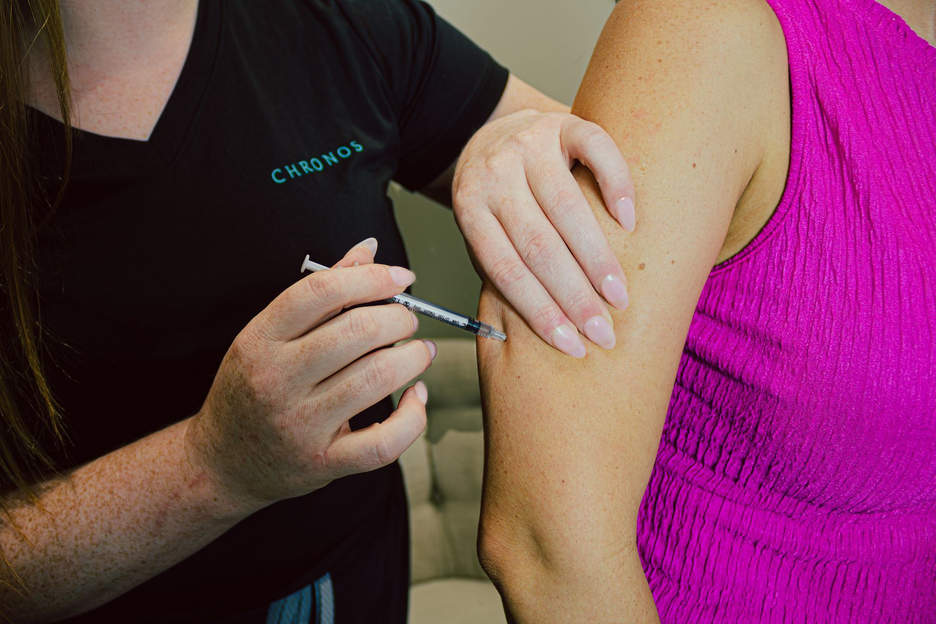 Chronos provider injects medical weight loss GLP-1 Semaglutide or Tirzepatide into patient's arm for healthy weight loss