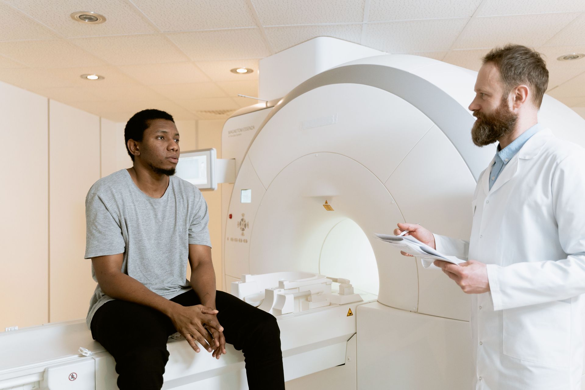 Man discussing testosterone replacement therapy results and timeline with healthcare provider.