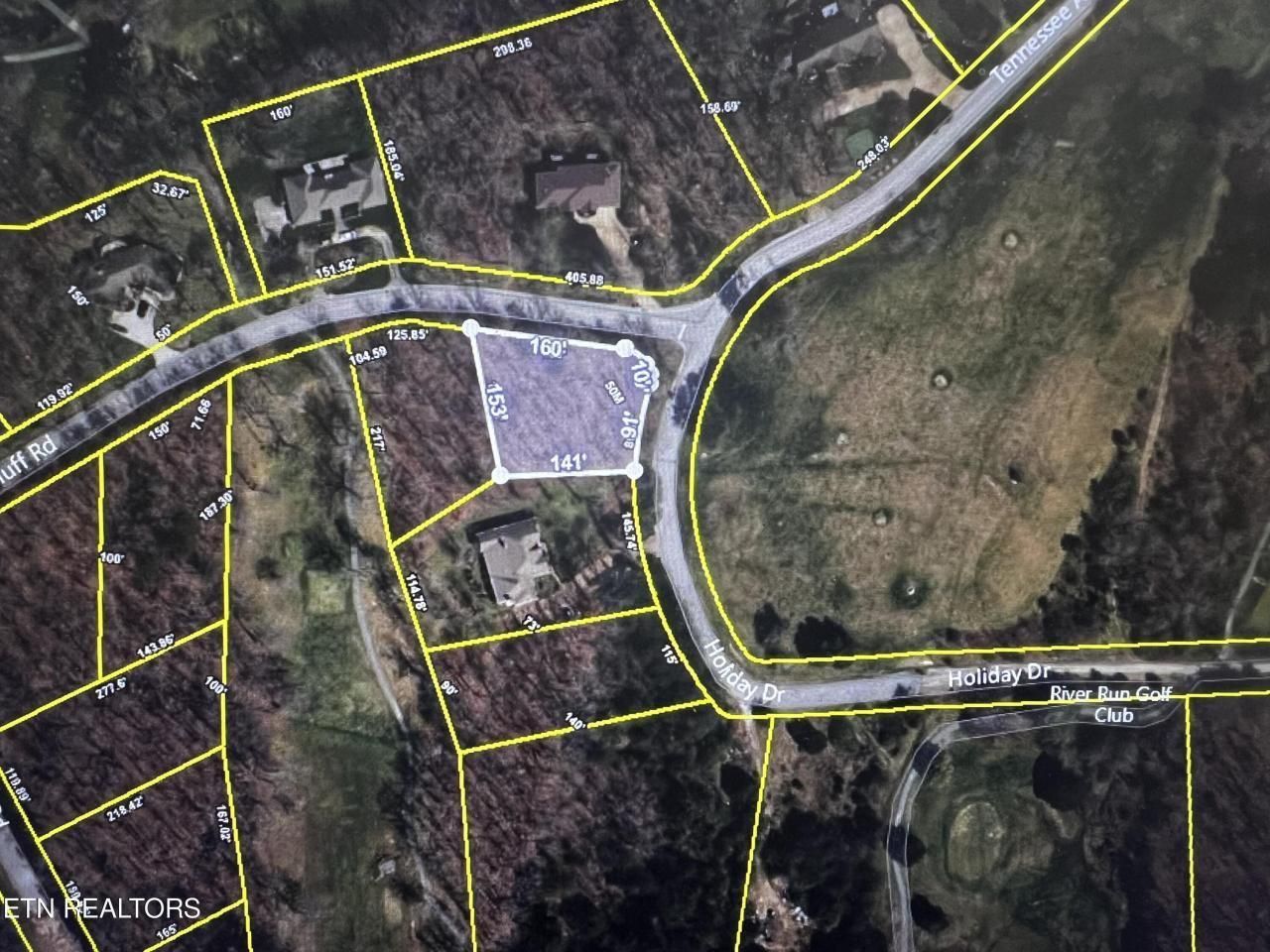 An aerial view of a residential area with lots of yellow lines