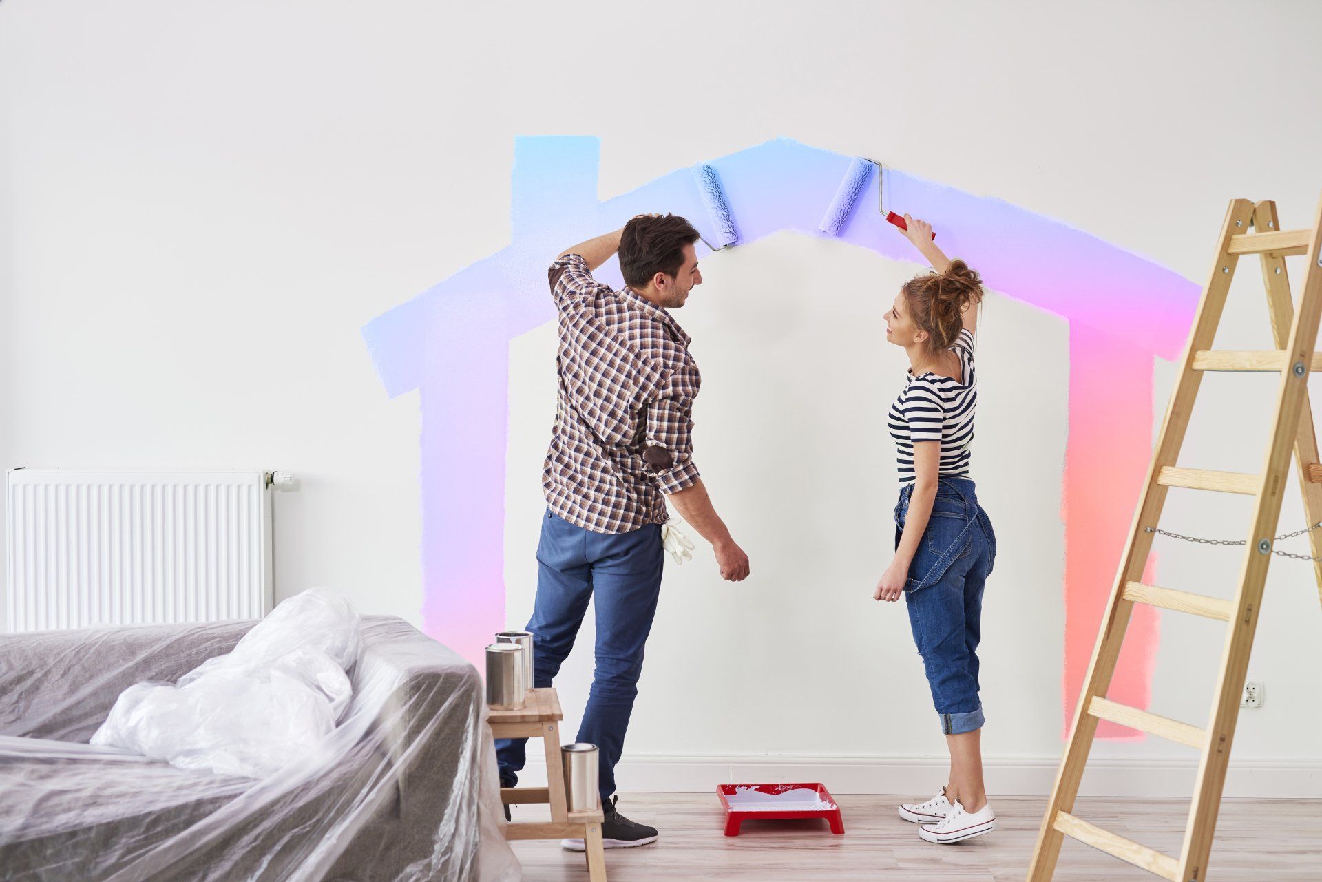 Couple painting house