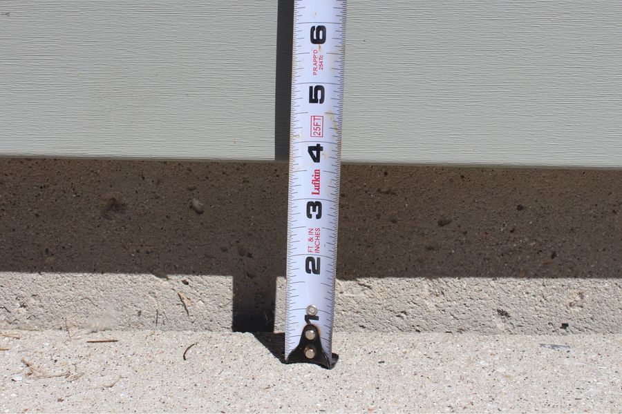 A white tape measure with the number 2 on it