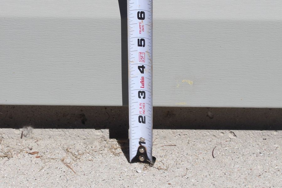 A white tape measure with the number 2 on it