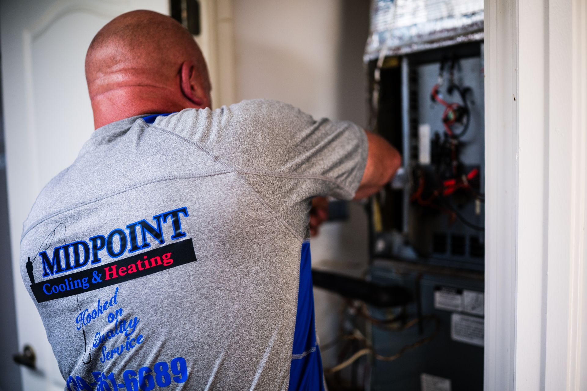Midpoint Cooling & Heating technician at work in Fort Myers