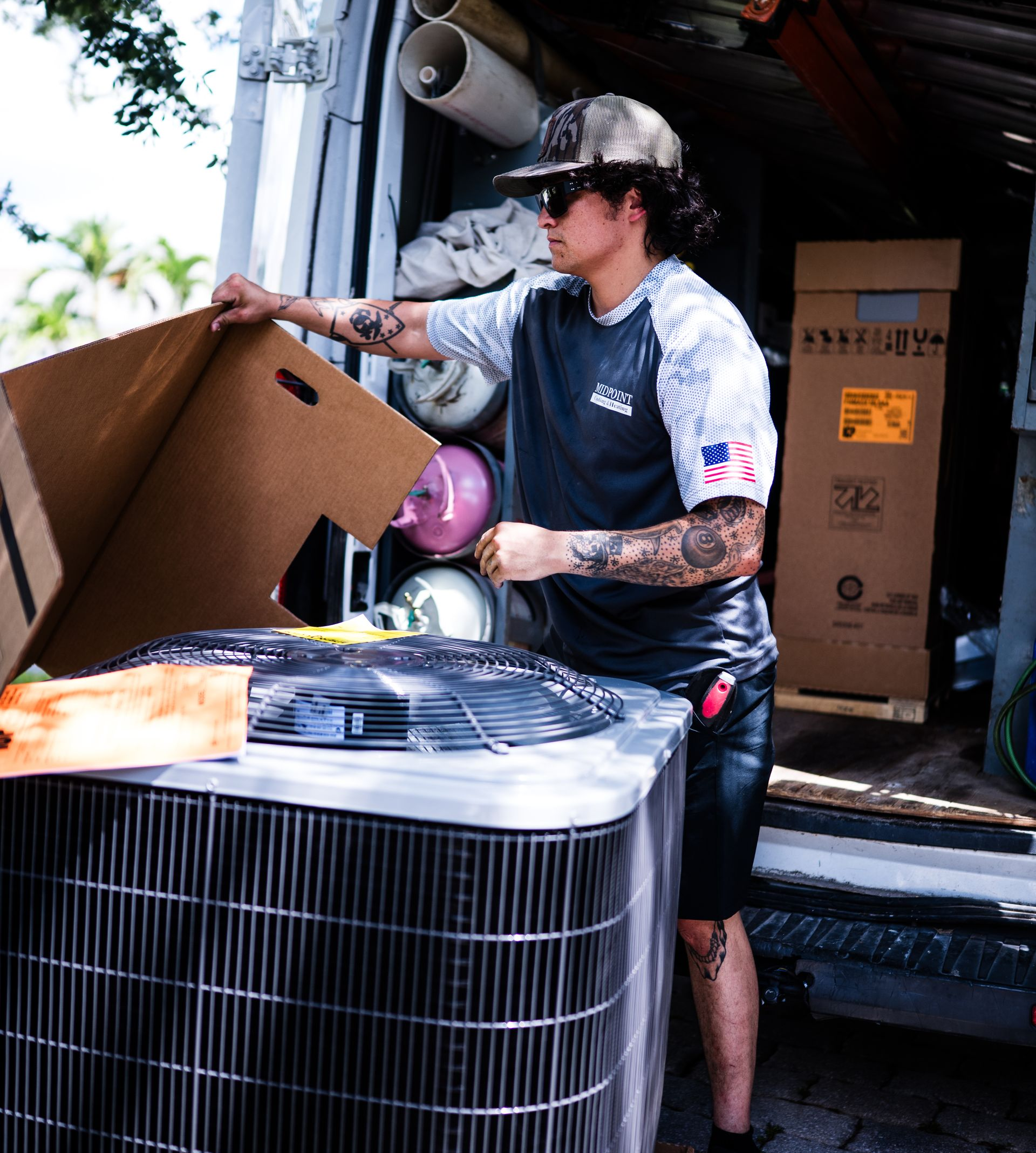 HVAC technician servicing a residential air conditioning unit